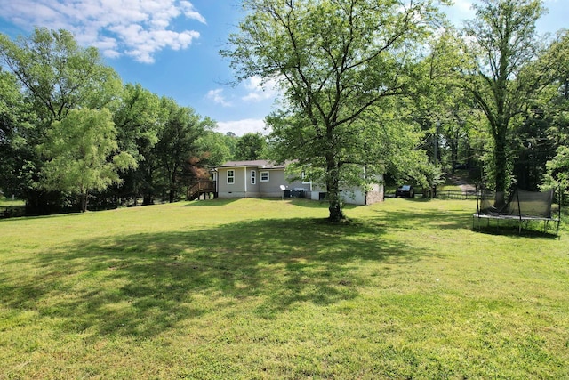view of yard with a trampoline