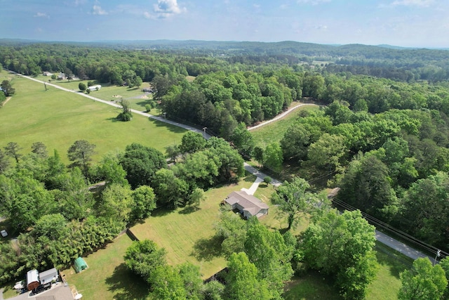 drone / aerial view featuring a view of trees