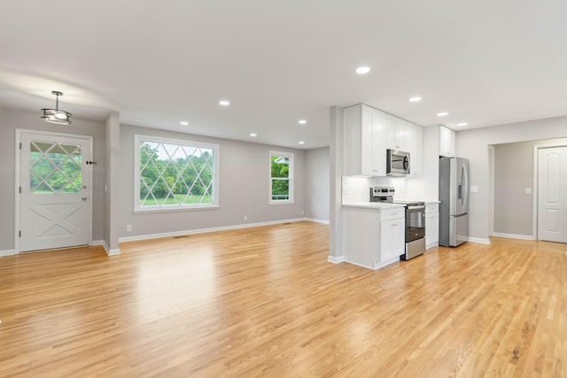 1025 Goshentown Rd, Hendersonville, TN 37075 - kitchen featuring stainless steel appliances, white cabinets, light wood finished floors, baseboards, and recessed lighting