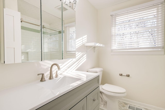 full bathroom with visible vents, a stall shower, vanity, baseboards, and toilet
