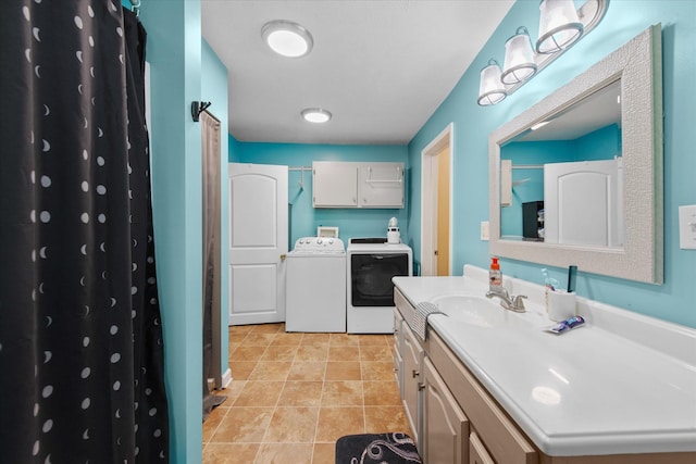 111 Stacker Dr, Clarksville, TN 37040 - bathroom featuring washing machine and clothes dryer, a shower with shower curtain, tile patterned flooring, and vanity