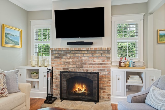 2004 Natchez Trce, Nashville, TN 37212 - living room featuring ornamental molding, a brick fireplace, and wood finished floors