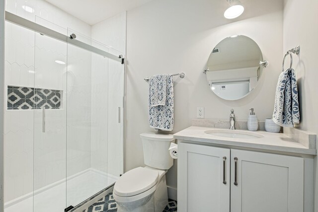 2004 Natchez Trce, Nashville, TN 37212 - full bathroom featuring vanity, toilet, and a shower stall