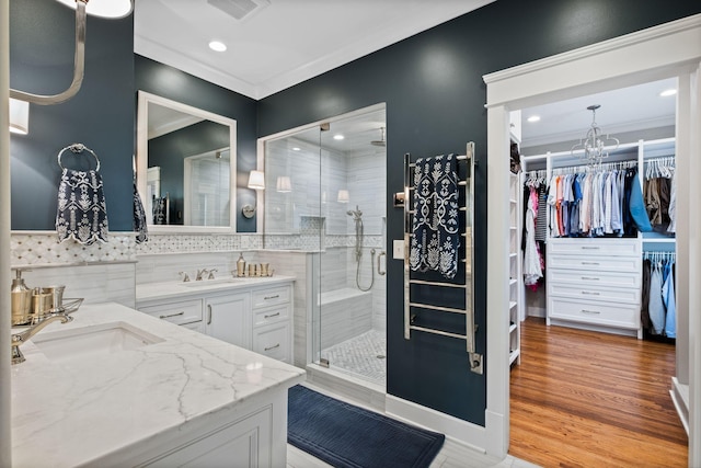 2004 Natchez Trce, Nashville, TN 37212 - bathroom with visible vents, crown molding, a shower stall, vanity, and recessed lighting
