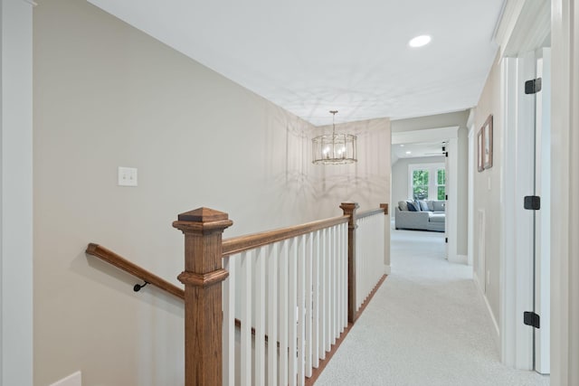 2004 Natchez Trce, Nashville, TN 37212 - corridor with a notable chandelier, carpet flooring, recessed lighting, and an upstairs landing