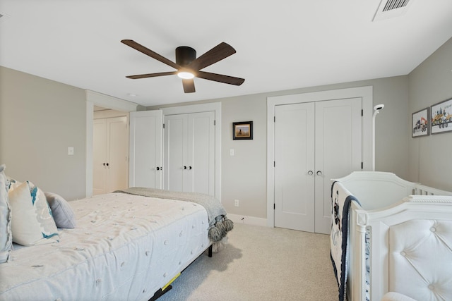 2004 Natchez Trce, Nashville, TN 37212 - bedroom with ceiling fan, light carpet, two closets, baseboards, and visible vents