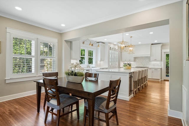 2004 Natchez Trce, Nashville, TN 37212 - dining area with baseboards, ornamental molding, wood finished floors, and a chandelier
