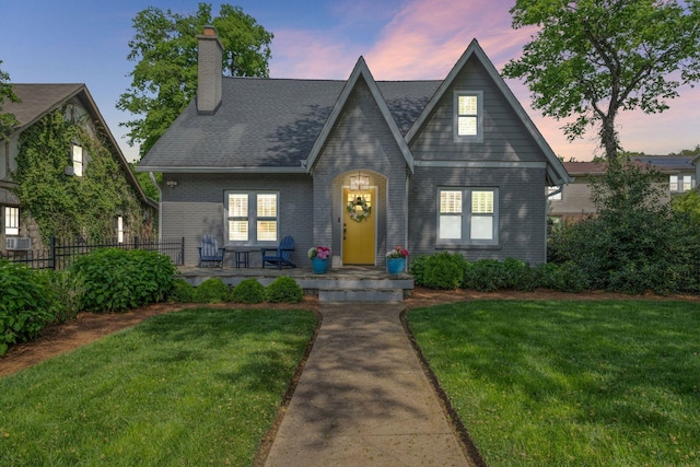 2004 Natchez Trce, Nashville, TN 37212 - tudor home with fence, covered porch, a chimney, and a front yard