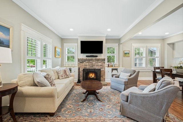 2004 Natchez Trce, Nashville, TN 37212 - living room featuring crown molding, plenty of natural light, a fireplace, and wood finished floors