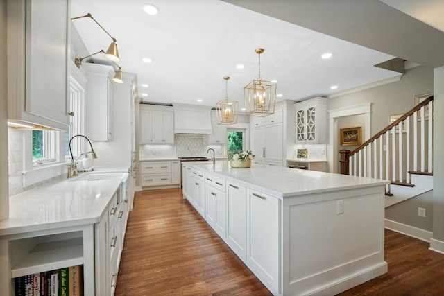 2004 Natchez Trce, Nashville, TN 37212 - kitchen featuring a sink, decorative backsplash, dark wood finished floors, and a healthy amount of sunlight