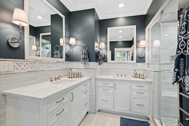 2004 Natchez Trce, Nashville, TN 37212 - full bathroom featuring two vanities, tile walls, ornamental molding, and a sink