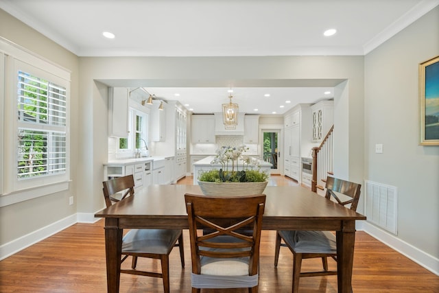 2004 Natchez Trce, Nashville, TN 37212 - dining room with stairs, baseboards, visible vents, and wood finished floors