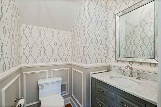 2004 Natchez Trce, Nashville, TN 37212 - bathroom featuring visible vents, vanity, a wainscoted wall, toilet, and a decorative wall