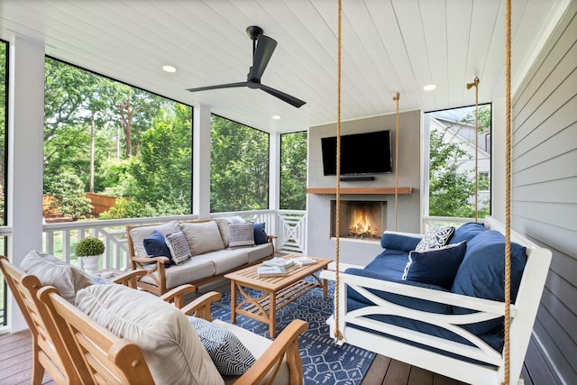 2004 Natchez Trce, Nashville, TN 37212 - sunroom / solarium with plenty of natural light, an outdoor living space with a fireplace, and ceiling fan