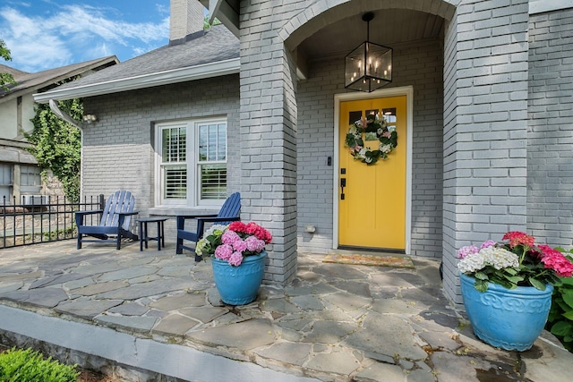 2004 Natchez Trce, Nashville, TN 37212 - entrance to property featuring brick siding, roof with shingles, and a chimney