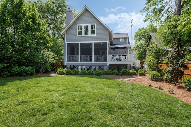 2004 Natchez Trce, Nashville, TN 37212 - back of house featuring fence, a wooden deck, a sunroom, a chimney, and a yard