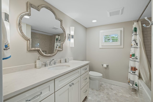 2004 Natchez Trce, Nashville, TN 37212 - full bath with toilet, baseboards, visible vents, and vanity