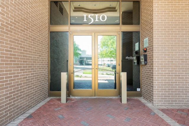 1510 Demonbreun St Unit 807, Nashville, TN 37203 - doorway to property with brick siding and french doors