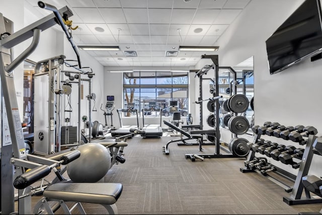 1510 Demonbreun St Unit 807, Nashville, TN 37203 - gym featuring visible vents, a drop ceiling, carpet, and a towering ceiling
