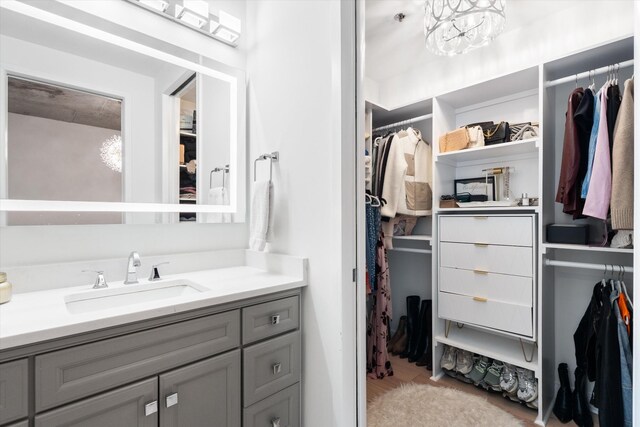 1510 Demonbreun St Unit 807, Nashville, TN 37203 - full bathroom with vanity, wood finished floors, and a spacious closet