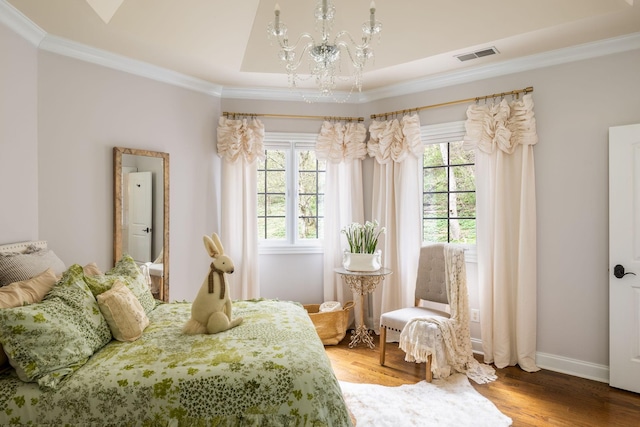 bedroom with crown molding, multiple windows, an inviting chandelier, and visible vents