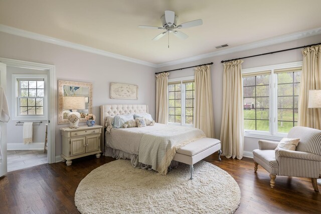 bedroom featuring visible vents, ornamental molding, baseboards, and dark wood-type flooring