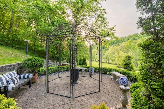 view of patio / terrace with a view of trees
