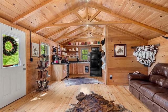 6498 Arno College Grove Rd, College Grove, TN 37046 - living area with lofted ceiling with beams, light wood finished floors, wooden walls, and wooden ceiling