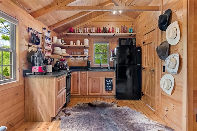 6498 Arno College Grove Rd, College Grove, TN 37046 - kitchen with wooden walls, lofted ceiling with beams, light wood finished floors, wood ceiling, and black appliances