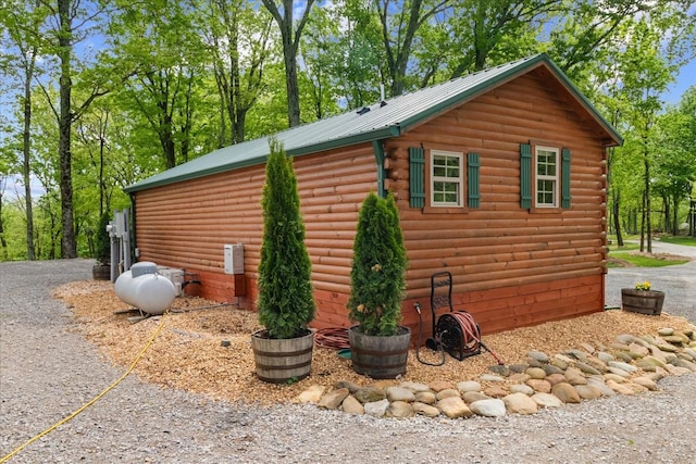 6498 Arno College Grove Rd, College Grove, TN 37046 - view of side of home featuring log exterior and metal roof
