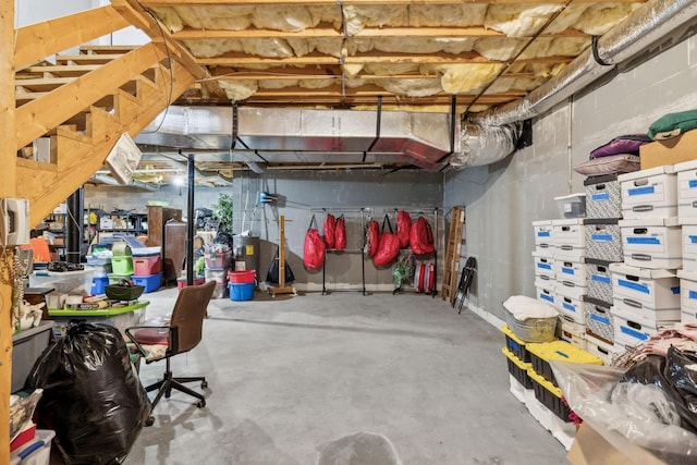 unfinished basement featuring electric water heater