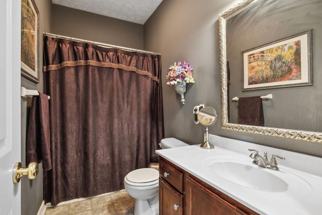 full bathroom featuring tile patterned flooring, vanity, toilet, a textured ceiling, and a shower with curtain