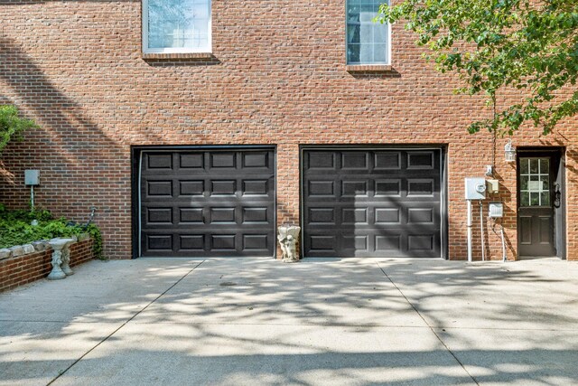 garage featuring driveway