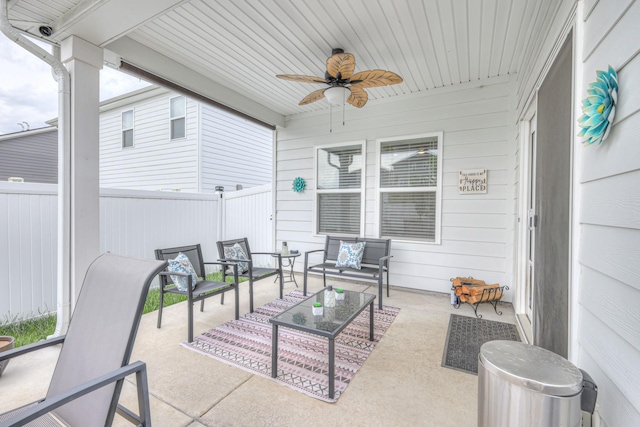view of patio with a fenced backyard, ceiling fan, and an outdoor living space
