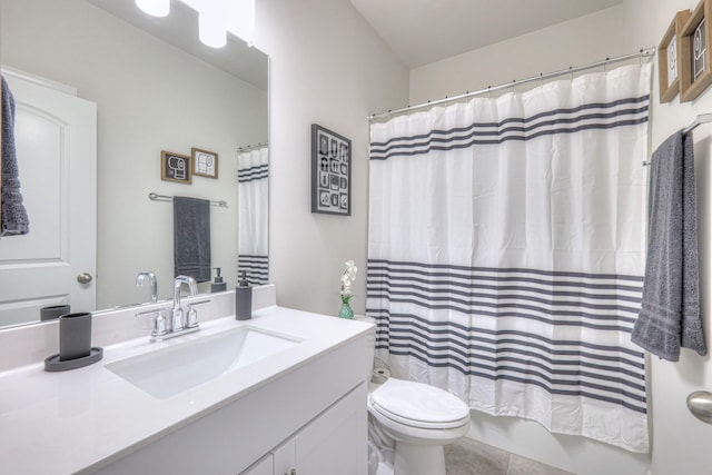 bathroom featuring vanity, tile patterned floors, toilet, and shower / tub combo