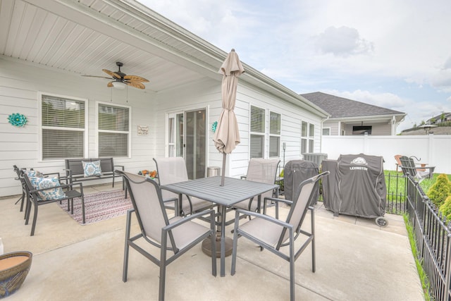 view of patio with ceiling fan, fence, outdoor dining space, and an outdoor hangout area