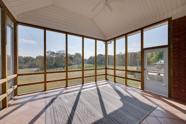 unfurnished sunroom with a rural view
