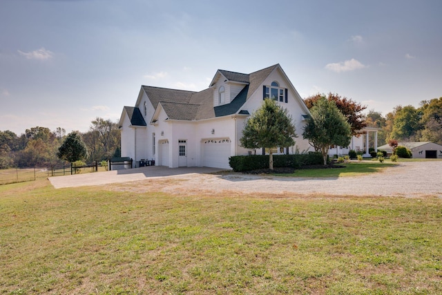 view of side of home with a lawn, fence, driveway, and a garage