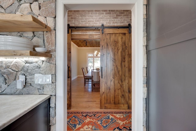 interior space featuring baseboards and wood finished floors