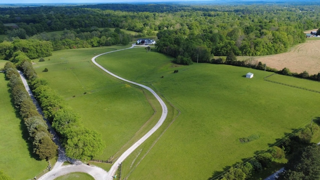 drone / aerial view featuring a forest view and a rural view