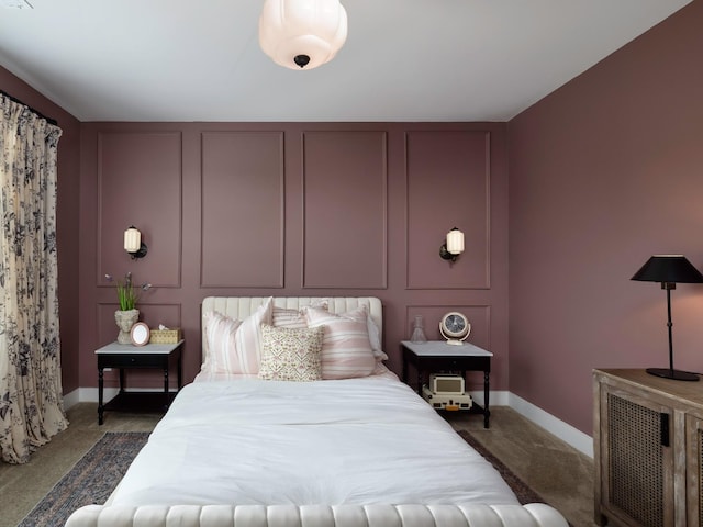 2025 Hornsby Dr, Franklin, TN 37064 - bedroom featuring baseboards, dark carpet, and a decorative wall