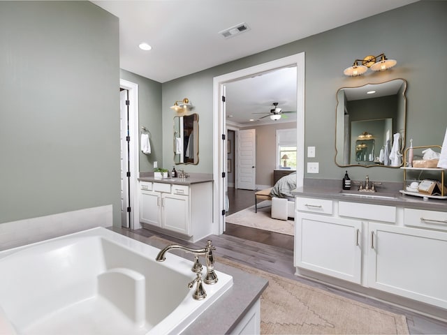 2025 Hornsby Dr, Franklin, TN 37064 - full bath with connected bathroom, visible vents, a sink, and wood finished floors
