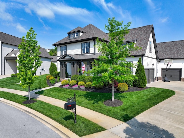 2025 Hornsby Dr, Franklin, TN 37064 - american foursquare style home with driveway, a shingled roof, a front yard, and a garage
