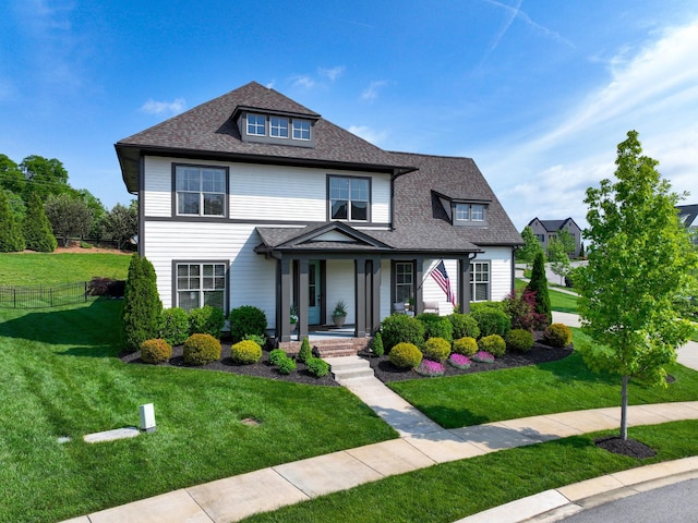 2025 Hornsby Dr, Franklin, TN 37064 - view of front of home with fence, covered porch, a shingled roof, and a front lawn