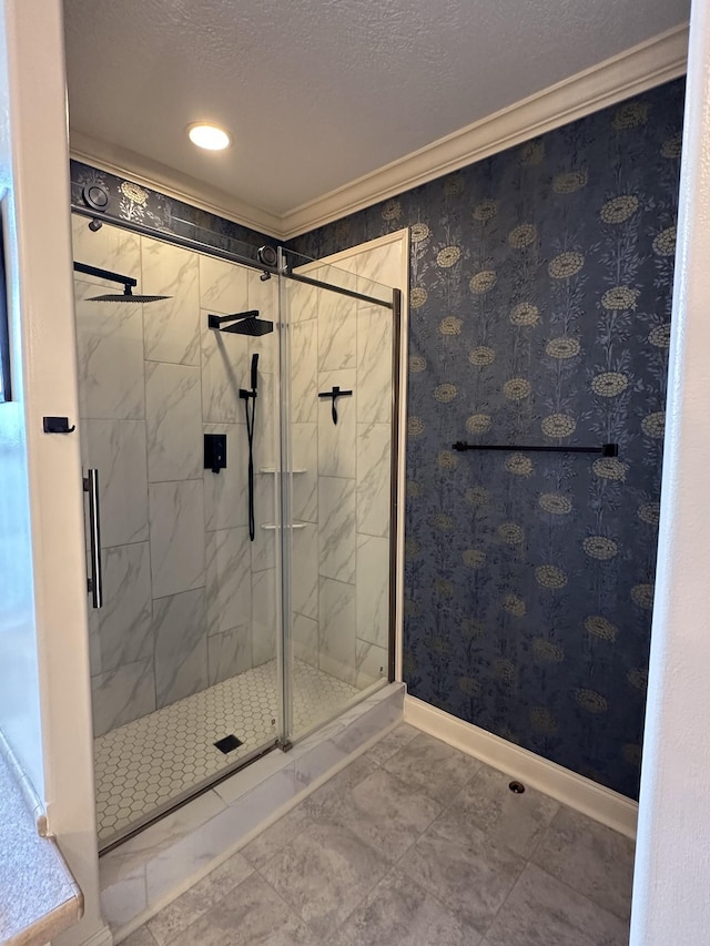 full bath with a stall shower, baseboards, ornamental molding, and a textured ceiling