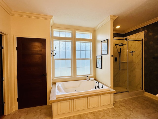 bathroom with a shower stall, a tub with jets, and crown molding