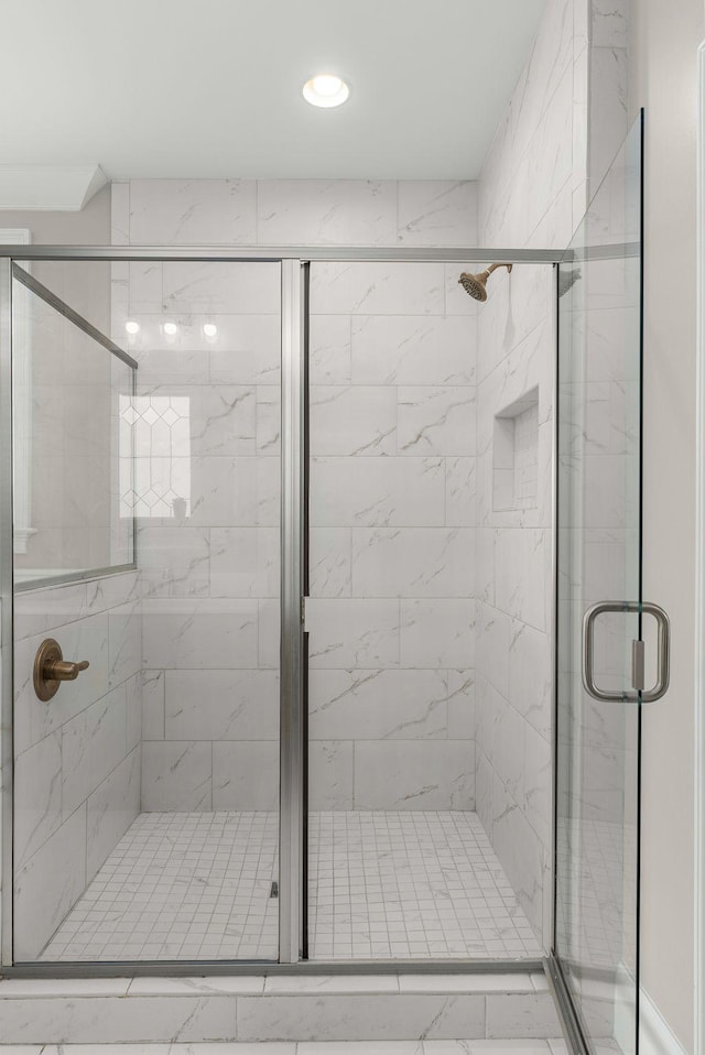 full bath with recessed lighting and a shower stall