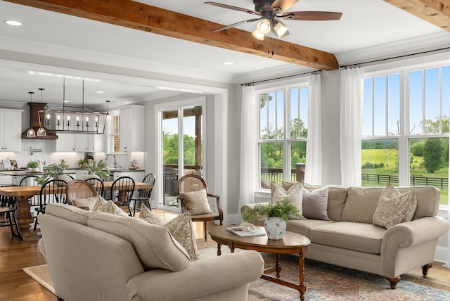 interior space featuring a sink, plenty of natural light, beamed ceiling, and french doors