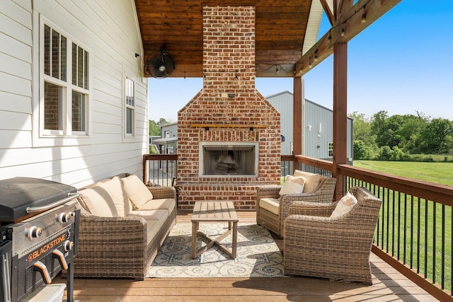 wooden deck featuring an outdoor living space with a fireplace and grilling area