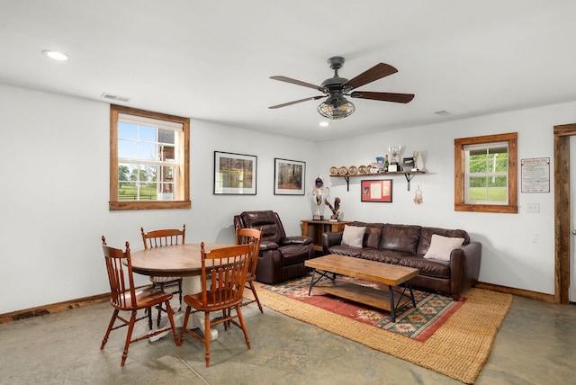 living area with ceiling fan, visible vents, concrete flooring, baseboards, and recessed lighting